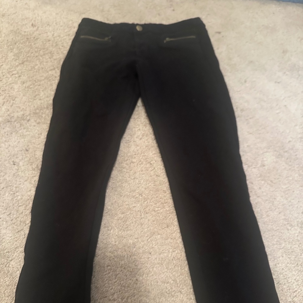 Black skinny pants with front zipper details